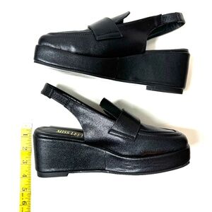 Ladies black leather strap back wedge loafers